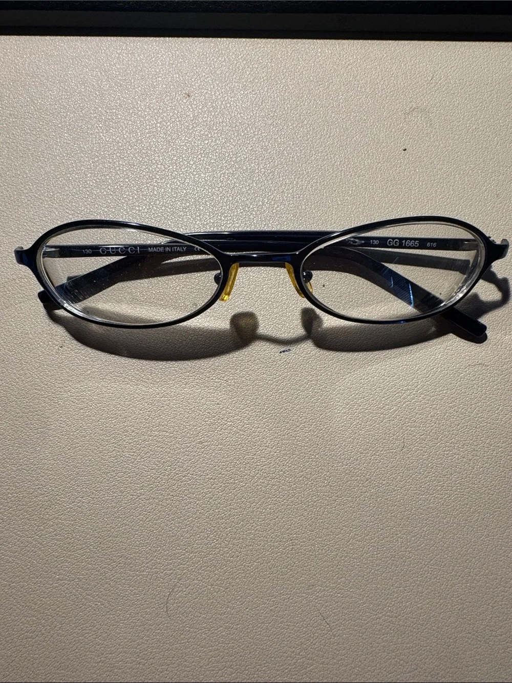 Gucci Black Oval Glasses with Gold Nose Pads